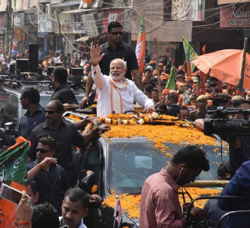 PM Narendra Modi at a road show in the holy city of Varanasi ahead of the last phase of polling in Uttar Pradesh on March 8. Narendra Modi