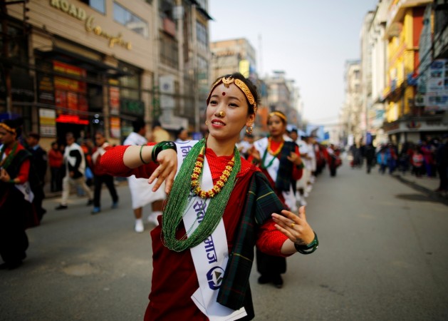 A Gurung girl wearing a traditional costume dances while taking part in Tamu Lhosar or Losar (New Year) parade in Kathmandu, Nepal December 30, 2016. nepal investment summit, chinese investments in nepal, indian investments in nepal, india nepal trade, india nepal relations