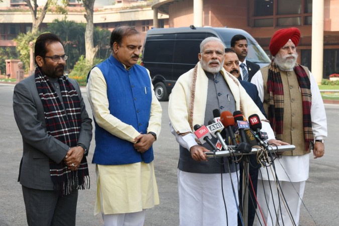 Prime Minister Narendra Modi addressing the ahead of Budget Session of Parliament, in New Delhi on January 31, 2017. Also seen are ministers in his government. modi comment on gst, gst draft laws, budget session of parliament, pm modi, finance bill 2017, stock markets, logistics stocks