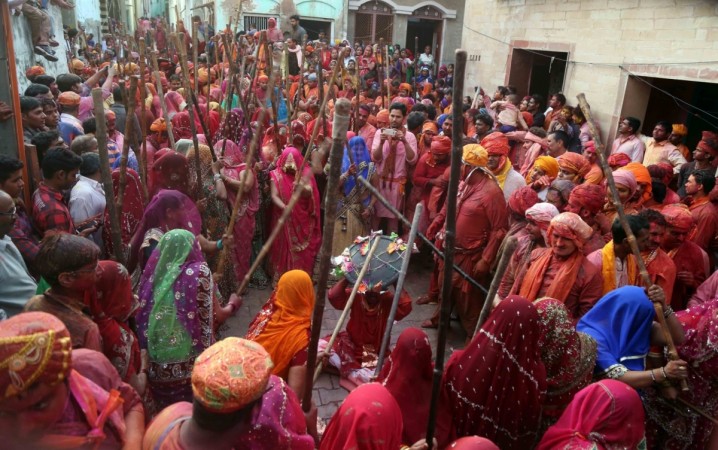 People celebrate holi 2017, happy holi 2017, stock markets to remain closed for holi, exit poll 2017, bjp win in uttar pradesh, kapda fad holi, lathmar holi
