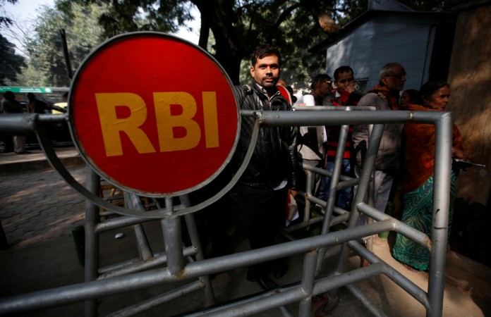 People queue outside the Reserve Bank of India (RBI) to exchange their old high denomination bank notes in New Delhi, India, December 30, 2016. rbi, impact of demonetisation, impact of note ban, indian economy, rbi updates on note ban, pm modi, uttar pradesh election results 2017, congress, indian opposition parties