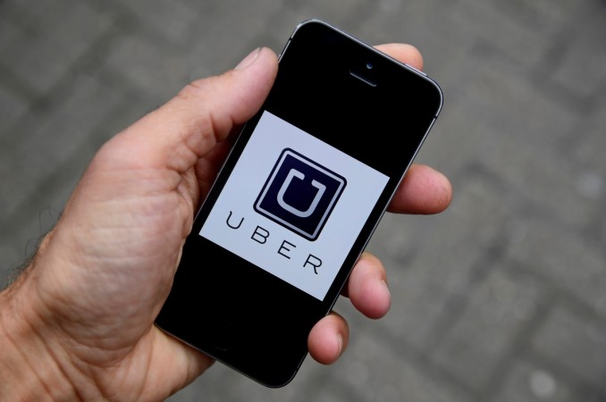 The Uber app logo is seen on a mobile telephone in this October 28, 2016 photo illustration. The Uber app logo is seen on a mobile telephone