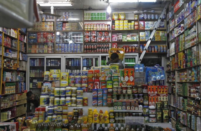 A salesman carries items in a basket inside a family-run grocery store in New Delhi September 18, 2012 (representational image). colgate palmolive, fmcg companies in india, hul, dabur, retail stores, grocery stores, toothpaste, patanjali