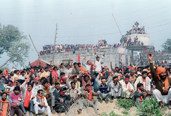 Hindu fundamentalists listen to speeches by leaders around a disputed mosque in the north Indian town of Ayodhya December 6, 1992. The mosque was later torn down by belligerent volunteers, threatening widespread strife in India, where the Hindu-majority 850 million people includes 100 million moslems. Babri Masjid