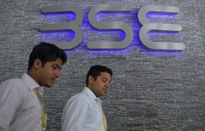 Employees walk out of the Bombay Stock Exchange (BSE) building in Mumbai August 22, 2013. stocks at 52 week high, buzzing stocks, eros share price, mrf share price, grasim share price, sensex, usd vs inr, indian stock markets