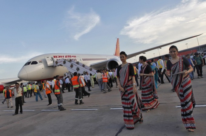 Air hostesses walk next to the parked Air India's Boeing 787-8 Dreamliner air india, air india flights to tel aviv, india israel relations, air india flights to israel, indian tourists to israel, indian civil aviation news