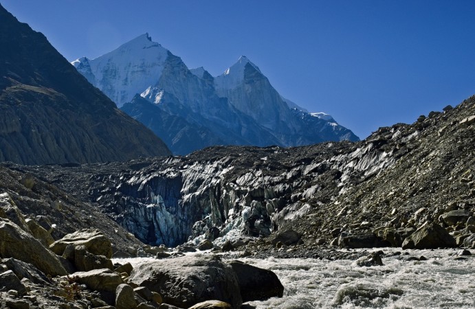 Gomukh, terminus of the Gangotri glacier. The Bhagirathi peaks rise in the background. Gomukh, terminus of the Gangotri glacier. The Bhagirathi peaks rise in the background.