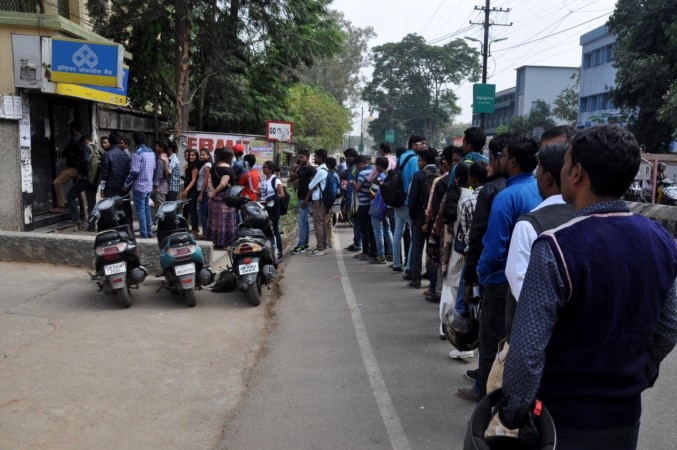 People queue up in front of a ATM in Ranchi, Jharkhand on Nov. 11, 2016. demo, namo, demonetisation, note ban, cash withdrawal from atm, queues at atms, banks, modi govt