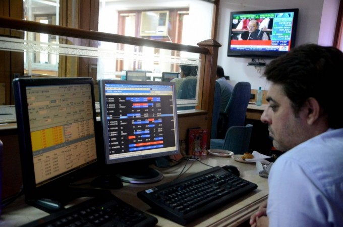 A stock broker looks at a television screen in Mumbai as Finance Minister Arun Jaitley presents India's first unified budget on February 1, 2017. bse, stock markets, stock broker, indian stock markets, bse sensex, nse nifty