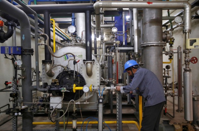 An employee works inside a research and development wing of Gas Lab Asia in New Delhi, India, March 8, 2017. The picture was taken on March 8, 2017. india gdp, asian development bank, adb projects india gdp for fy2018, indian economy
