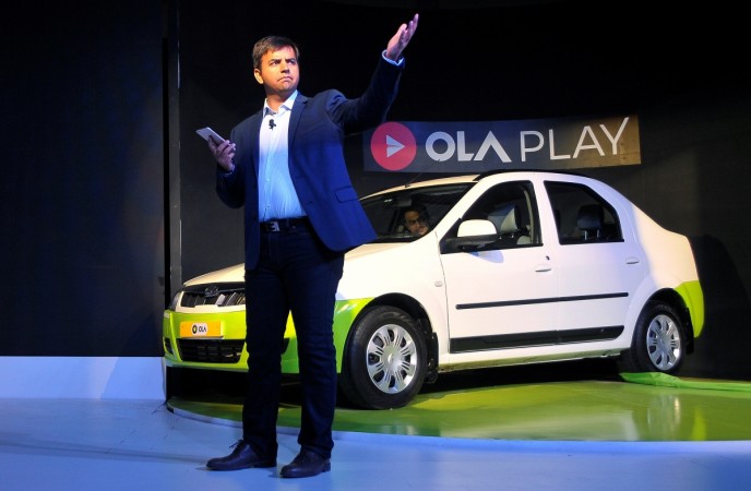 Bhavish Aggarwal, CEO and co-founder of Ola, gestures as he addresses the media during a news conference in Bengaluru, India, November 22, 2016. ola, olacabs, ola cabs, ola ceo bhavish aggarwal, ola founders, ola rival uber, cab hailing services in india