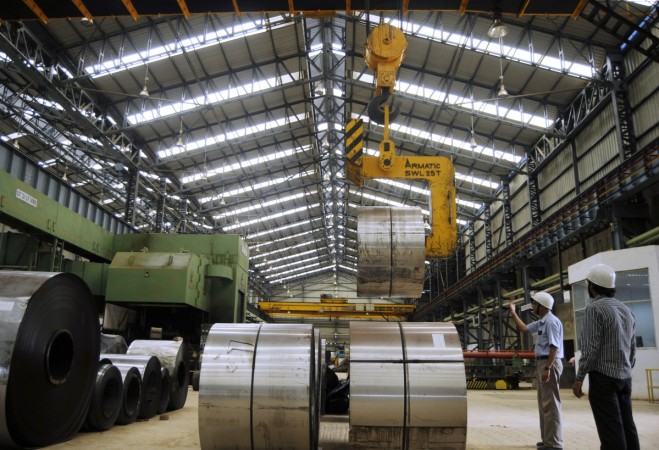 Employees work inside a steel factory in Agartala, capital of Tripura July 1, 2010. iron, steel, iron ore, metal stocks, commodities, mining, metal prices, tata steel, jsw, hindalco, arabian sea, india exports, trade data, india trade, indian economy, india imports