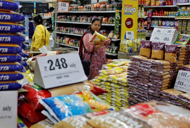 A woman looks at an item as she shops at a food superstore in Ahmedabad, India October 13, 2016. inflation, retail inflation, inflation for march 2017, india news, indian economy