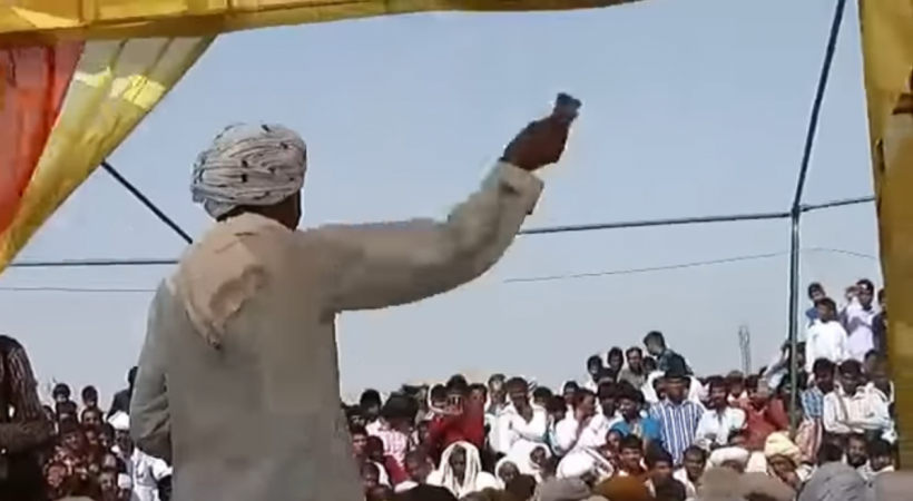 Leela Ram Gujjar, a tea-seller in Bhiwadi, Rajasthan standing with a bundle of cash in his hand. He reportedly gave Rs 1.5 crore dowry for daughters' wedding. dowry viral video