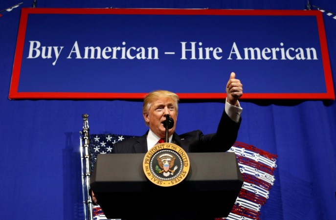 Donald Trump insists on buying American products and hiring American individuals during a press conference. H-1B visa, visa
