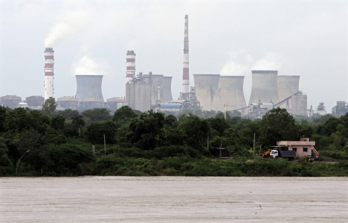 A thermal power station is pictured near the banks of flooded Mahisagar river at Thasra village in Kheda district of Gujarat September 7, 2012 (representational image). ntpc, ntpc plf for march 2017, ntpc share price, cea statistics, energy consumption in indian, solar power in india, wind power in india