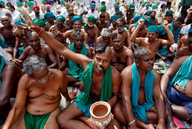 Farmers from the southern state of Tamil Nadu pose half shaved during a protest demanding a drought-relief package from the federal government, in New Delhi, India April 3, 2017. Tamil Nadu Farmers