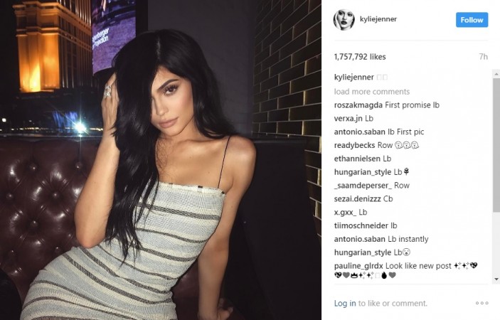 Kylie Jenner flaunting her strped mini-dress. Kylie Jenner