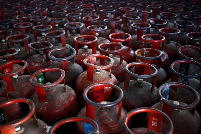 Empty Liquefied Petroleum Gas (LPG) cylinders are seen at a gas distribution centre at Dujana village in Noida, on the outskirts of New Delhi October 7, 2015. lpg imports by india, lpg imports by india, give it up campaign, pm modi pushes lpg campaign, modi govt, ppac data for march, india cruce oil imports