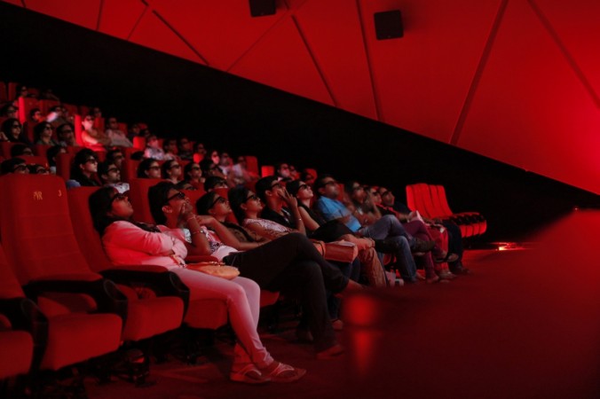 Cinema-goers wearing 3D glasses watch a movie at a PVR Multiplex in Mumbai November 10, 2013. multiplex association of india, cap on cinema ticket prices, karnataka govt puts cap on film ticket prices, pvr ticket prices, inox ticket prices