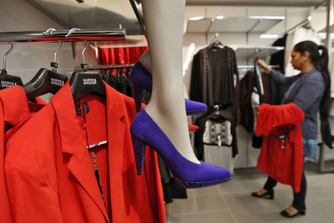 A customer shops inside a Marks & Spencer store in New Delhi india online retail, offline stores in india, ecommerce market in india, india etail stores, flipkart, snapdeal online sales, amazon india online sales