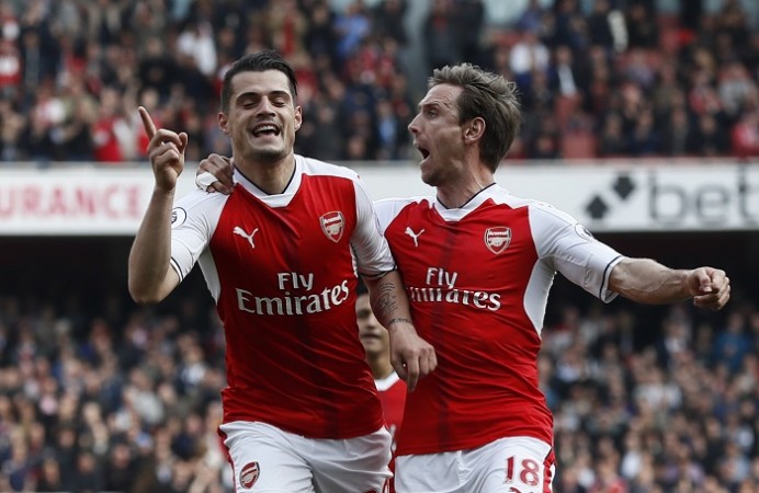 Arsenal duo Granit Xhaka (L) and Nacho Monreal Arsenal defeat Manchester United, Premier League results, Danny Welbeck, Granit Xhaka, Premier League, Arsene Wenger, Jose Mourinho, Arsenal vs Manchester United, Alexis Sanchez, Alex Oxlade-Chamberlain