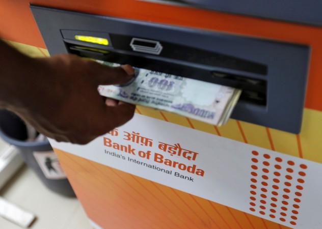 A customer withdraws money from a Bank of Baroda automated teller machine (ATM) in <span>Mumbai</span>, India, May 3, 2016. bank of baroda, bob, bank of baroda share price, banks, atms, atm, cash, rbi, cash withdrawal, note ban, demonetisation