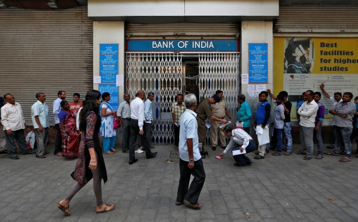 People wait to enter a bank in Mumbai, India, November 15, 2016. bank of india, bank of india new md, banks, bank stocks, share price, bank of india atm, banks, atms, note ban