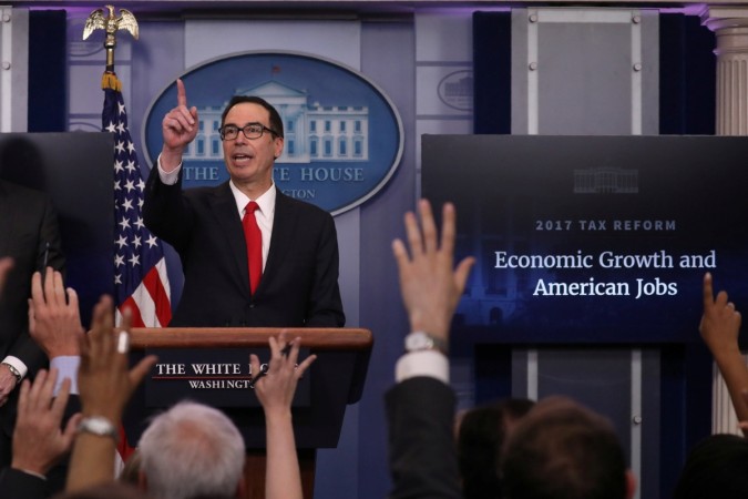 U.S. Secretary of the Treasury Steven Mnuchin discusses the Trump administration's tax reform proposal in the White House briefing room in Washington, U.S, April 26, 2017. us president donald trump, tax cuts by trump administration, impact of us tax cuts on india, angel broking, h1 b visa controversy