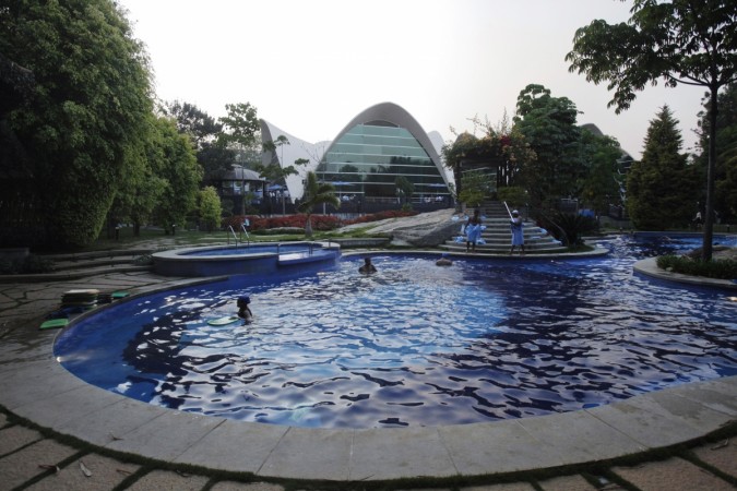 Employees of IT companies use a swimming pool at the Electronics City IT district in Bangalore, February 28, 2012 (representational image). it jobs, it layoffs, wipro layoffs, infosys layoffs, 6 lakh jobs under threat, head hunters, tcs layoffs, cts layoffs