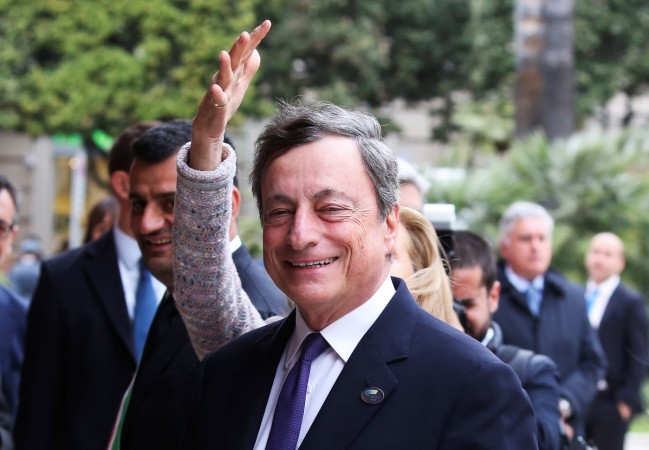 European Central Bank President Mario Draghi smiles as his wife adjusts his hair at the Petruzzelli Theatre during a G7 for Financial ministers in the southern Italian city of Bari, Italy May 11, 2017. g7, g7 summit, g7 countries, g7 economies, indian economy, global economy, chinese economy