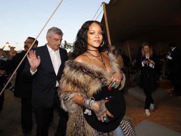 Singer Rihanna at the Dior Cruise Collection event wearing a controversial fur coat Rihanna