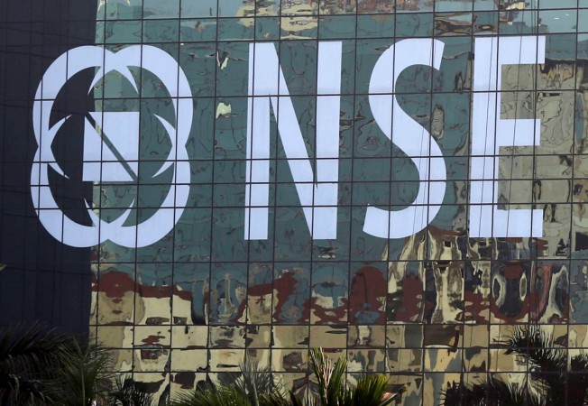 Buildings are reflected on the glass windows of the NSE (National Stock Exchange) building in Mumbai, India, December 27, 2016. nse nifty, nifty at new high, nifty at historic high, nifty at lifetime high, nifty to cross 10000, nifty to hit 10000, sensex gainers, 3 years of modi govt