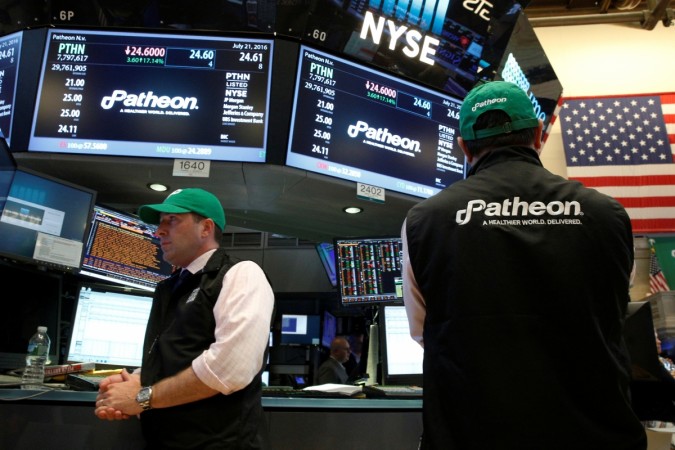 Traders work at the post where shares of Patheon NV is traded on the floor of the New York Stock Exchange Patheon NV