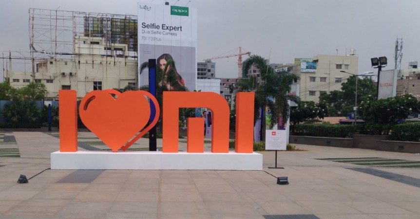 Xiaomi India logo tableau with Oppo ad in the background at Phoenix Market City Mall in Bengaluru, 11th May, 2017 Xiaomi Mi India logo, Mi India, top Chinese smarphone maker