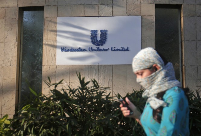 A pedestrian walks past the Hindustan Unilever Limited (HUL) headquarters in Mumbai. Unilever has entered into exclusive talks for acquiring Horlicks from GlaxoSmithKline India. hul, hul q4 results, hul net profit, hul and patanjali, hul products, hul share price, hindustan unilever, fmcg companies in india, dabur, patanjali ayurved