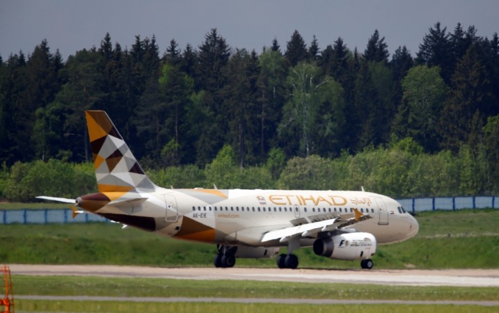 An Etihad Airways plane is seen at Minsk international airport near the village of Slabada, Belarus, May 19, 2016 etihad airways, etihad investments in alitalia, alitalia files for bankruptcy, ryanair, airberlin, emirates vs etihad, jet airways, jet airways share price, naresh goyal jet airways