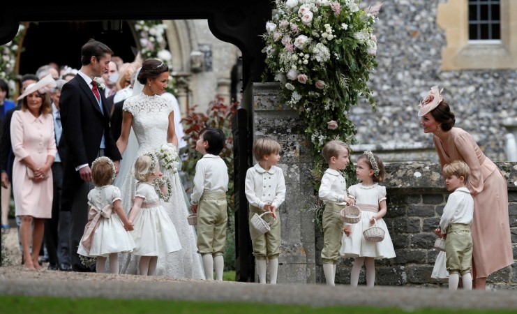 Britain's Catherine, Duchess of Cambridge stands with her son Prince George as she looks across at Pippa Middleton and James Matthews after their wedding at St Mark's Church in Englefield, Britain May 20, 2017. Pippa Middleton wedding