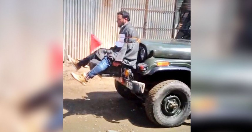 A screengrab of the video showing a civilian tied to an army jeep. Human shield