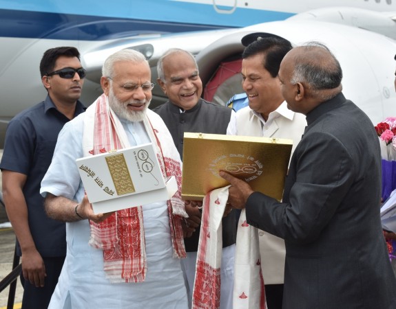 Prime Minister Narendra Modi being welcomed by the Governor of Assam, Shri Banwarilal Purohit and the Chief Minister of Assam, Shri Sarbananda Sonowal on his arrival, in Dibrugarh, Assam on May 26, 2017. Narendra Modi