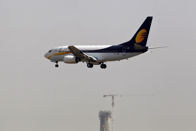 A Jet Airways passenger plane prepares to land at the Indira Gandhi International Airport in New Delhi. The lenders to the debt-laden airline have set relaxed conditions looking for an investor who can implement the debt resolution plan. jet airways, jet airways q4 results, jet airways share price, aviation stocks, spicejet share price, spicejet q4 results