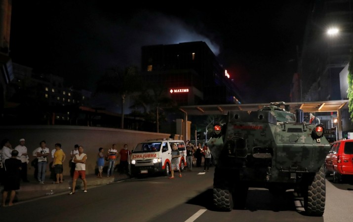 An armoured fighting vehicle (AFV) arrives near the Resorts World Manila after gunshots and explosions were heard in Pasay City, Metro Manila, Philippines June 2, 2017. Manila Phillippines