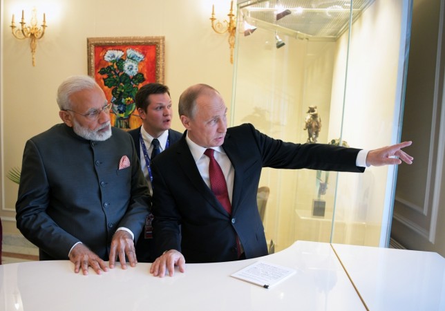 Russian President Vladimir Putin (R) speaks with Indian Prime Minister Narendra Modi during a meeting on the sidelines of the St. Petersburg International Economic Forum (SPIEF), Russia, June 1, 2017. Modi Putin