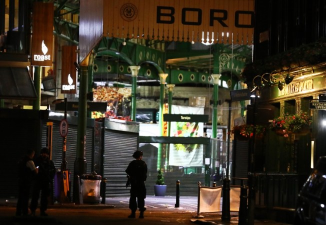 Armed police officers stand in Borough Market after an incident in the London Bridge area of London, Britain June 4, 2017. London
