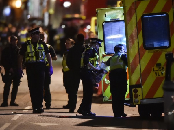 Police officers speak with ambulance personnel after an incident near London Bridge in London, Britain June 4, 2017. London