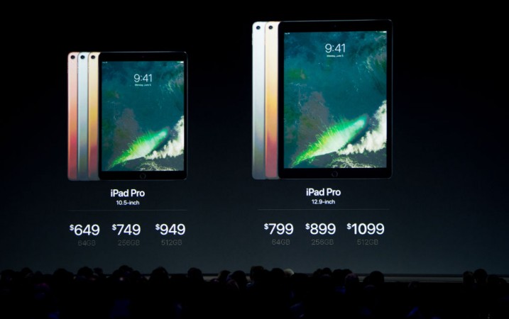 Prices for the new iPad Pro models are shown on stage during Apple's World Wide Developers Conference in San Jose, California on June 5, 2017. New iPad Pro models