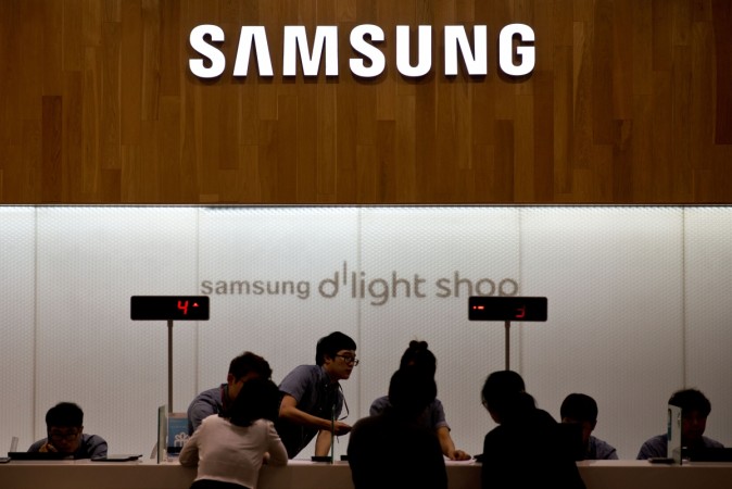 In this picture, a Samsung logo is displayed above a check-out counter at a Samsung showroom in Seoul on July 31, 2014. Samsung