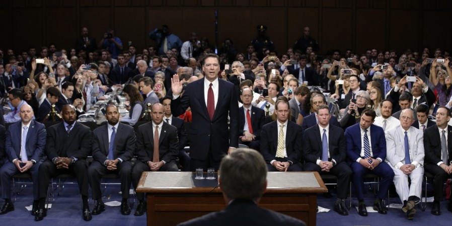 Former FBI Director James Comey is sworn in to testify before a Senate Intelligence Committee hearing on FBI Director James Comey