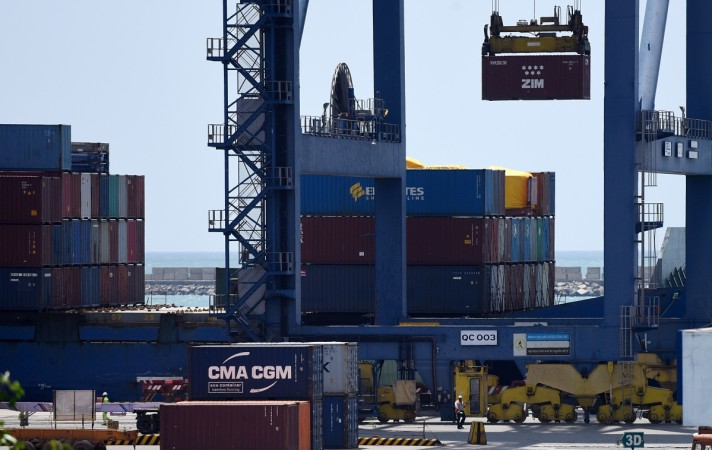 Indian workers use a crane to move crates at a container terminal in Chennai harbour on August 3, 2016. india, external trade, merchandise trade, india exports, imports, trade deficit, gold imports, engg imports, fiscal deficit, nirmala