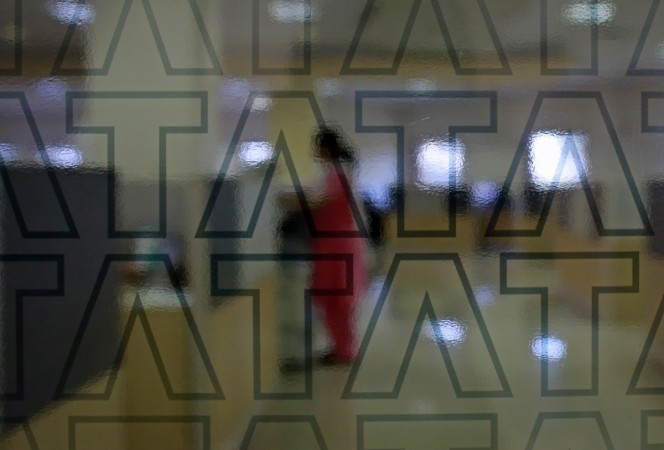 A Tata Consultancy Services (TCS) employee works inside the company headquarters in Mumbai in this March 14, 2013 file photo. REUTERS/Danish Siddiqui Tata